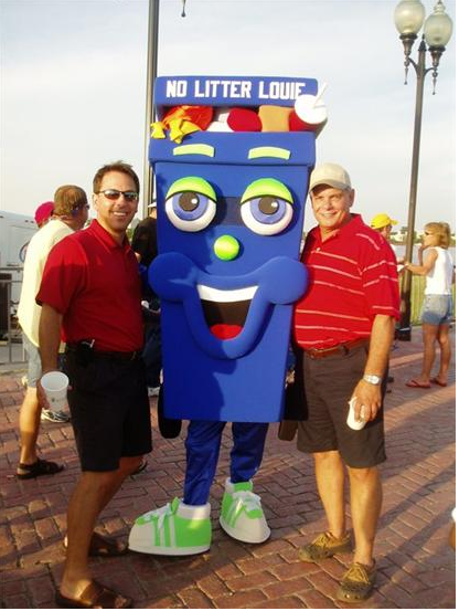 Two men pose with No Litter Louie mascot